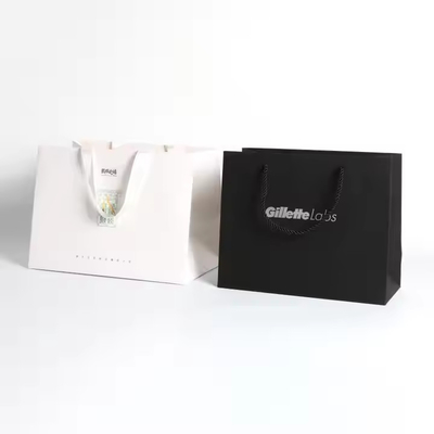 Bolsas de embalaje de papel con logotipo personalizable con mango de cinta de seda